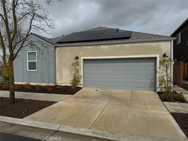 a front view of a house with garage