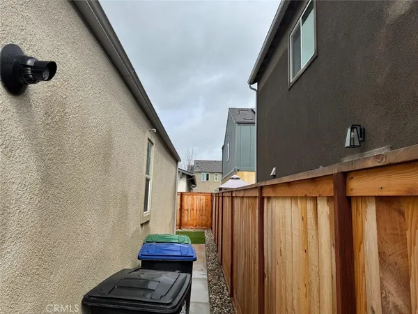 a view of a livingroom with wooden floor and furniture
