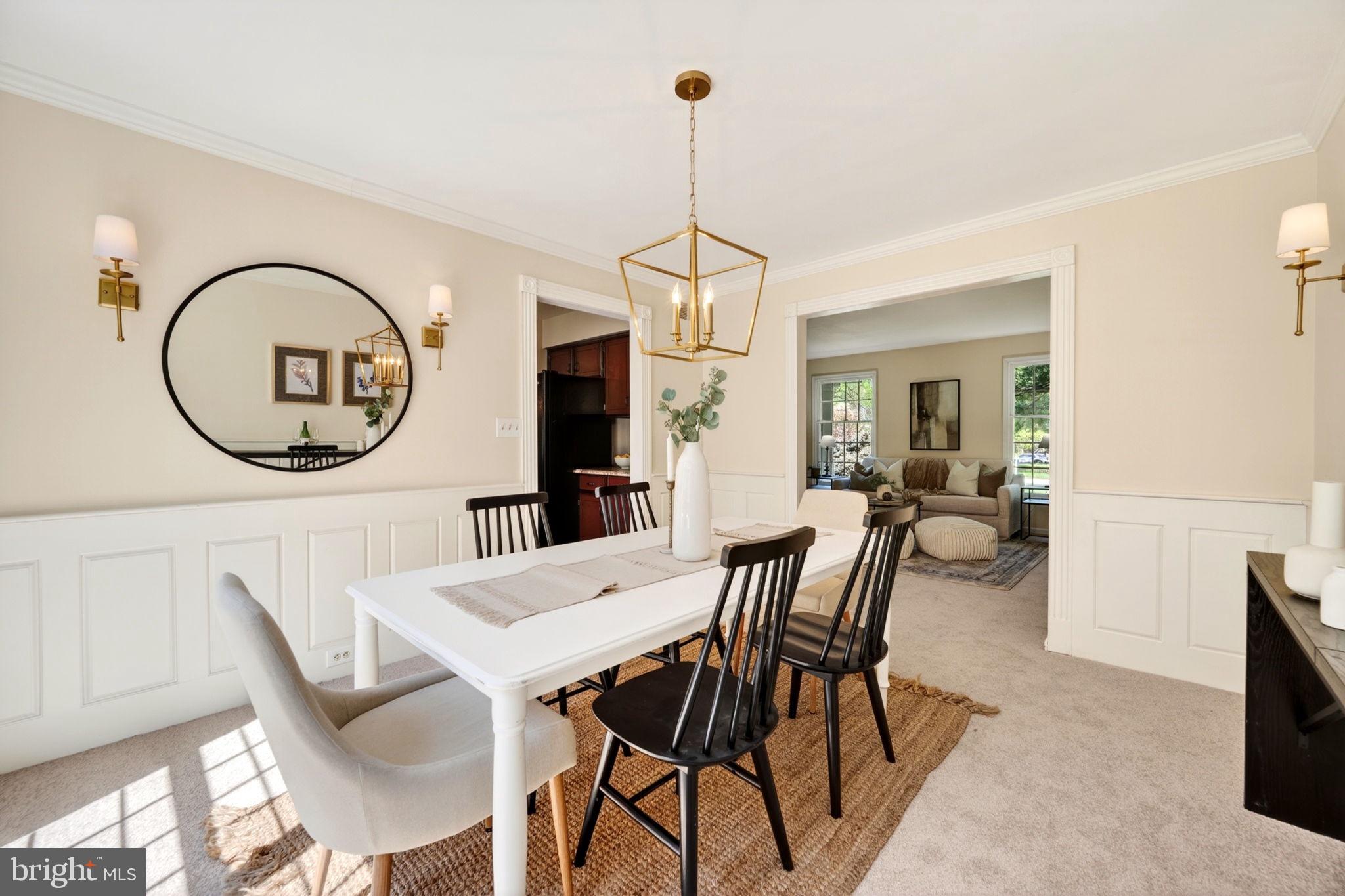 3805 Duddington Way Phoenix, MD 21131 - Photo 15 of 69 a dining room with furniture a rug and a chandelier