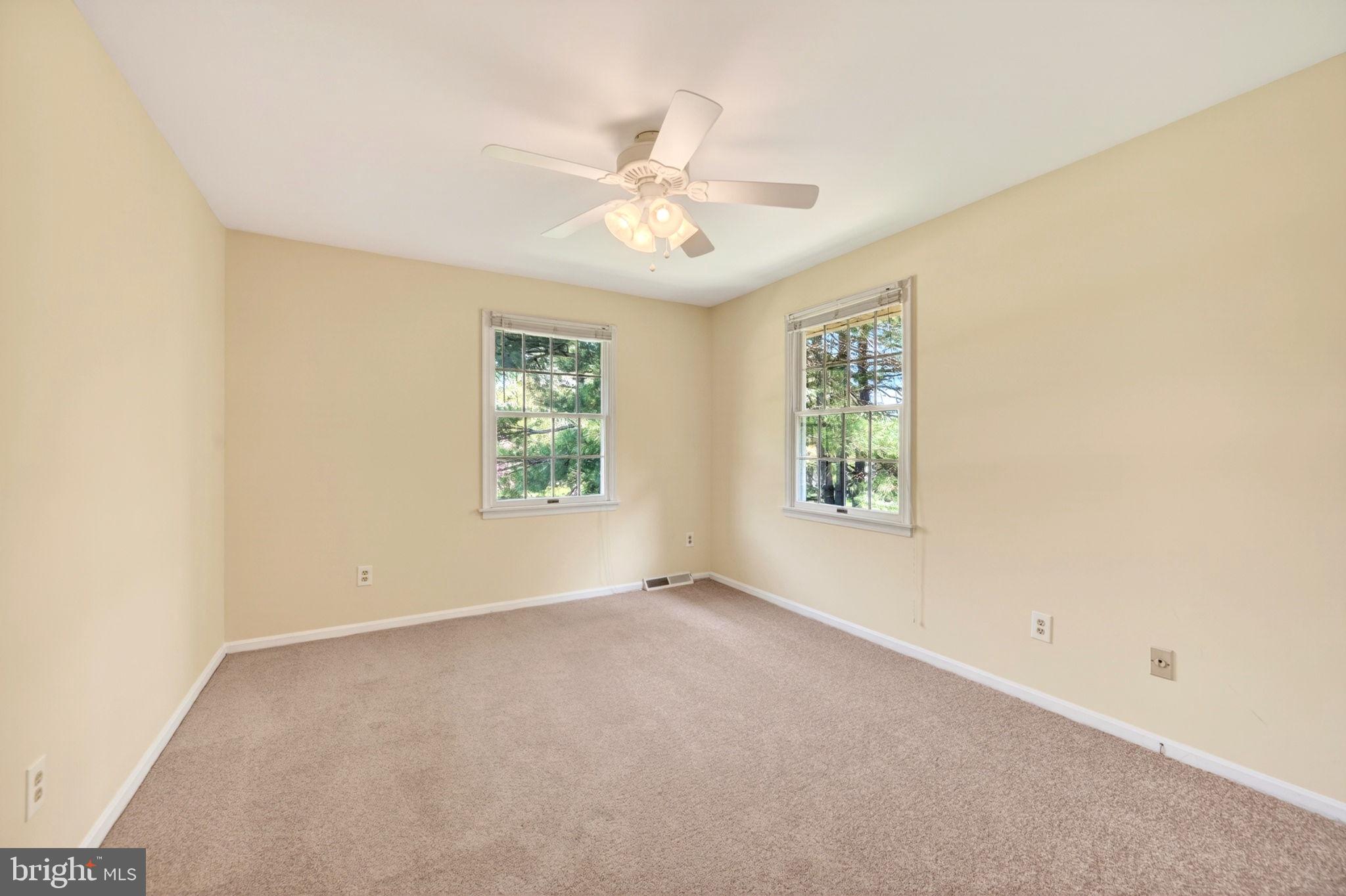 3805 Duddington Way Phoenix, MD 21131 - Photo 39 of 69 an empty room with windows and fan