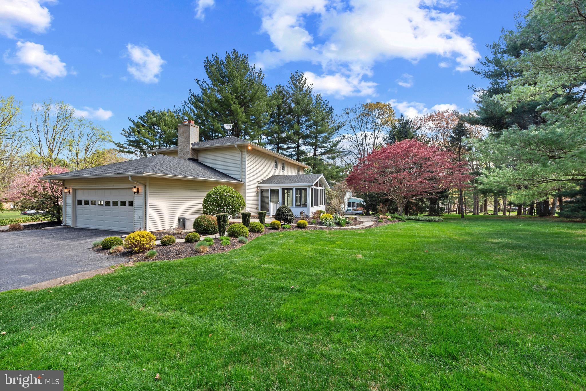 3805 Duddington Way Phoenix, MD 21131 - Photo 56 of 69 a front view of a house with garden and trees