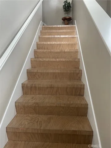 a view of staircase with white walls