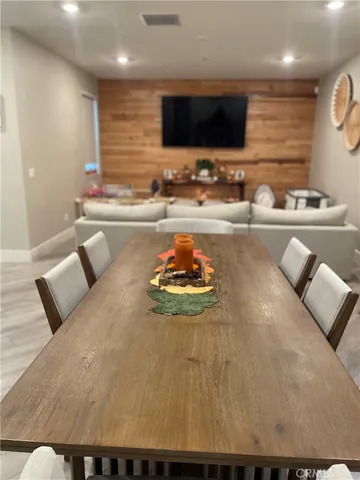 a kitchen with a dining table and chairs