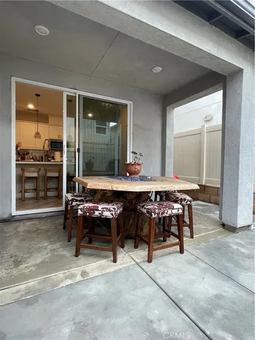 a view of a entryway door back of the house