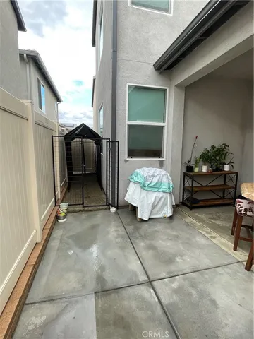 a dining room with a wooden table and chairs
