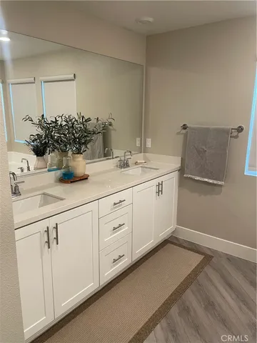 a bathroom with a sink and mirror
