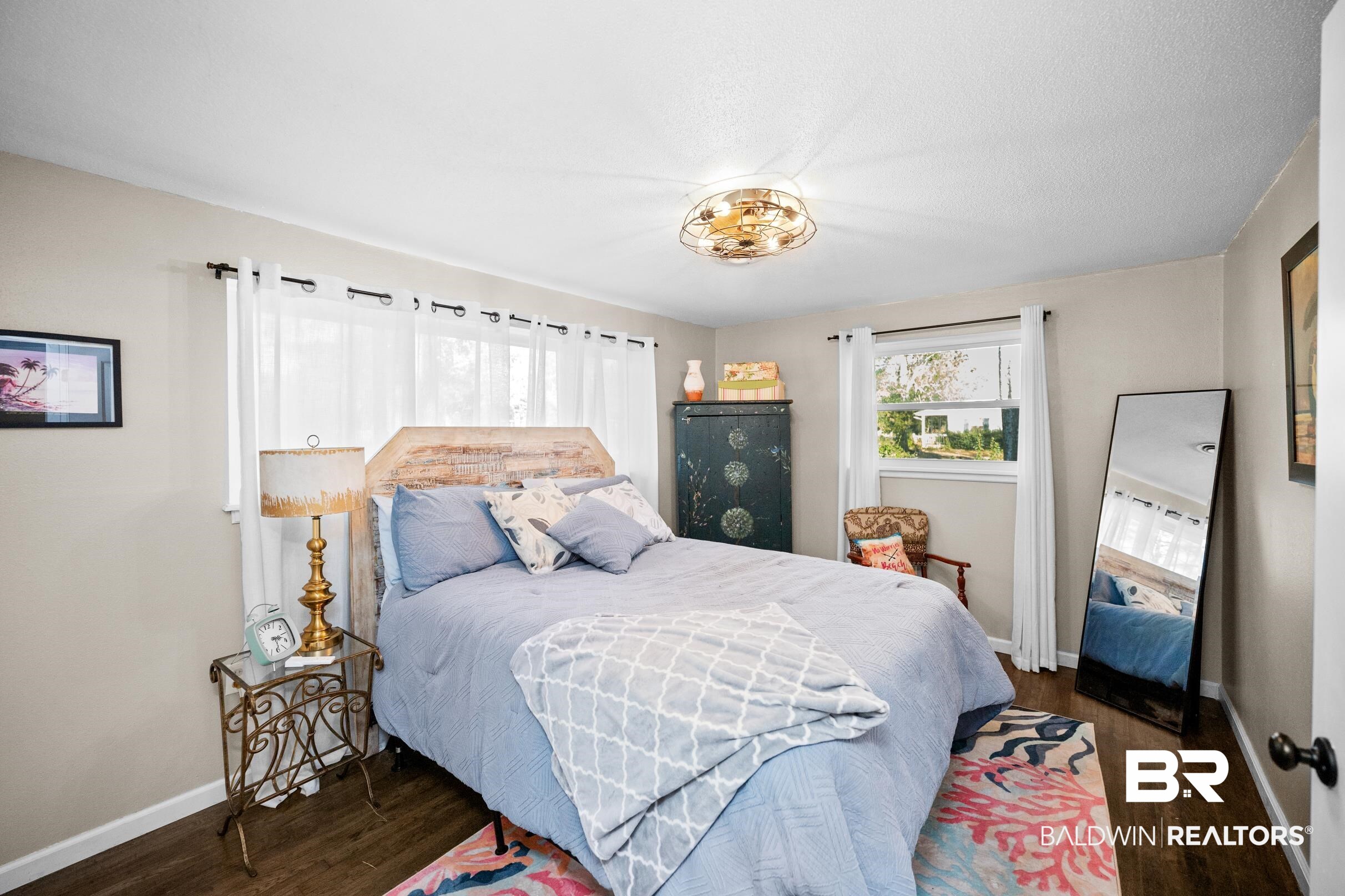 401 West Myrtle Avenue Foley, AL 36535 - Photo 20 of 39 Bedroom with dark wood-type flooring