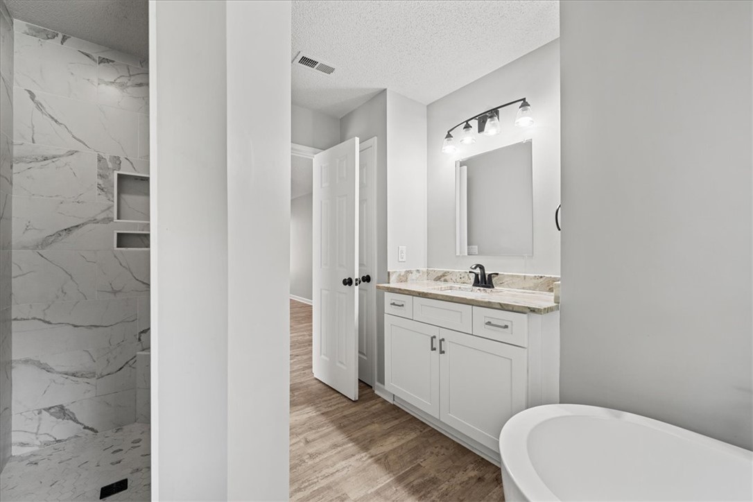 212 Blue Ridge Drive Clemson, SC 29631 - Photo 17 of 33 Modern bath offering a spacious walk-in shower and elegant vanity with ample storage.