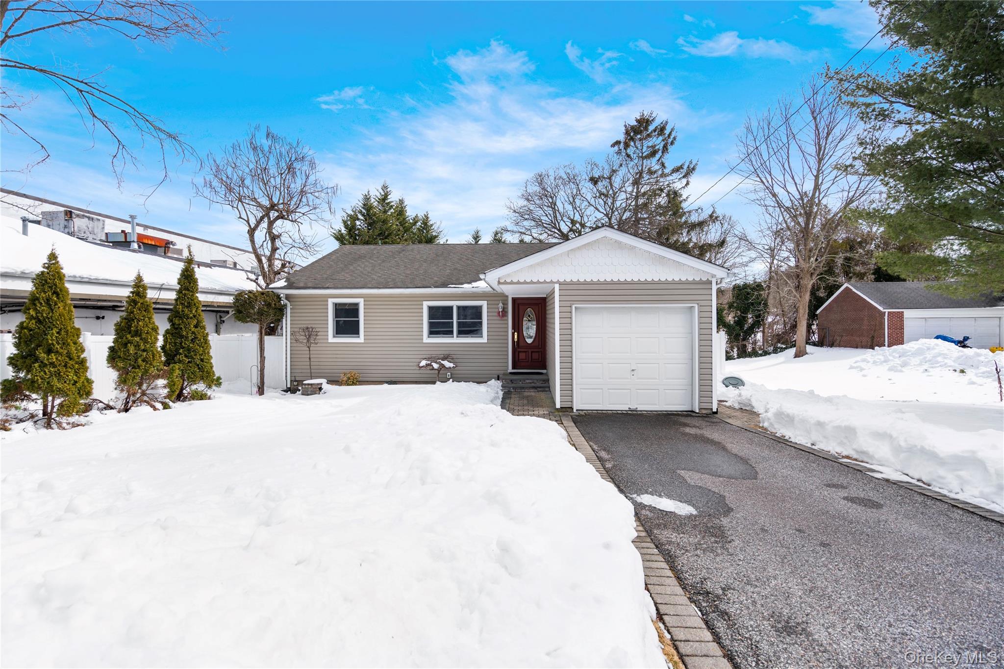25 State Place Huntington, NY 11743 - Photo 1 of 33 a front view of a house with a yard