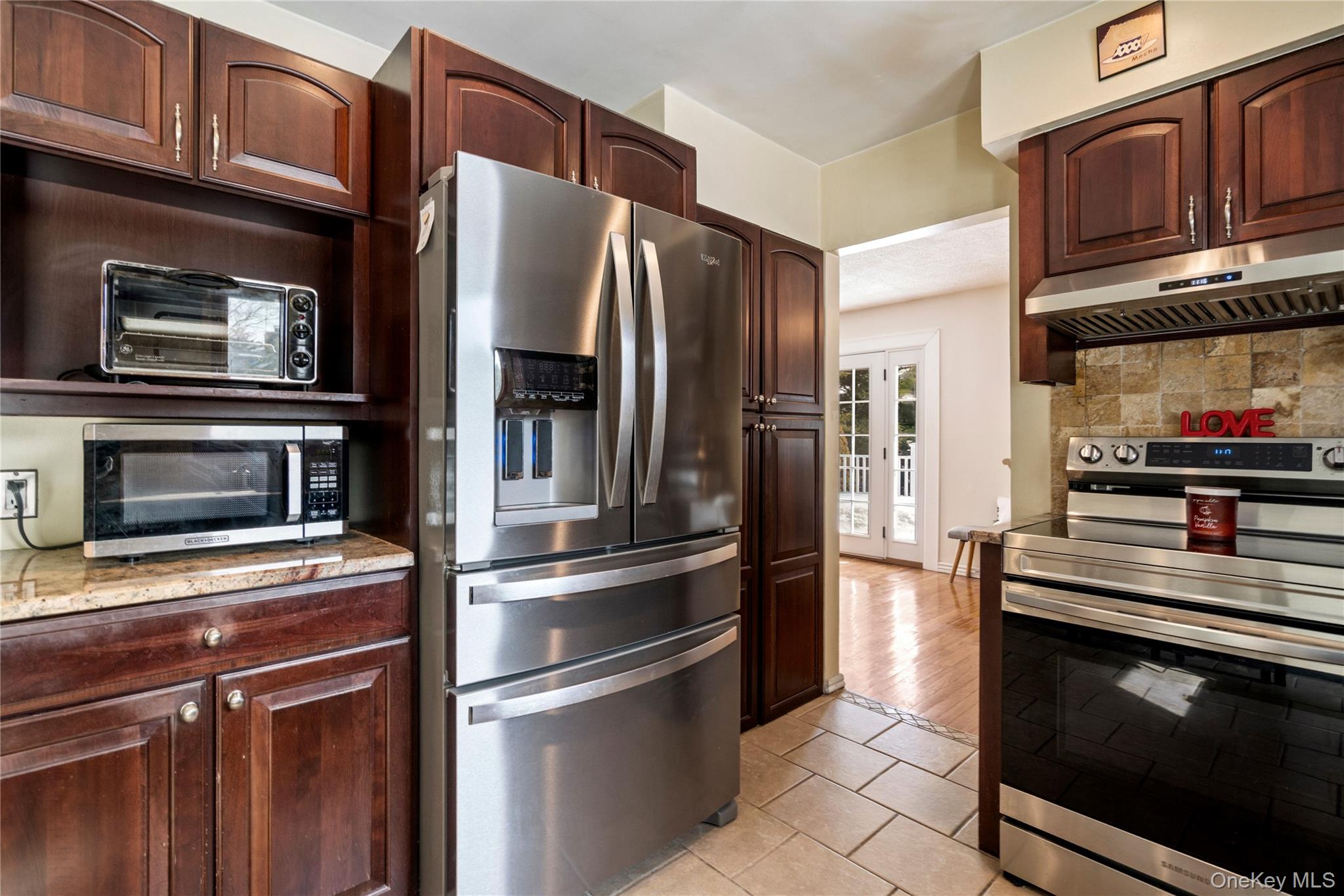 25 State Place Huntington, NY 11743 - Photo 15 of 33 a kitchen with stainless steel appliances and granite countertop refrigerator stove top oven