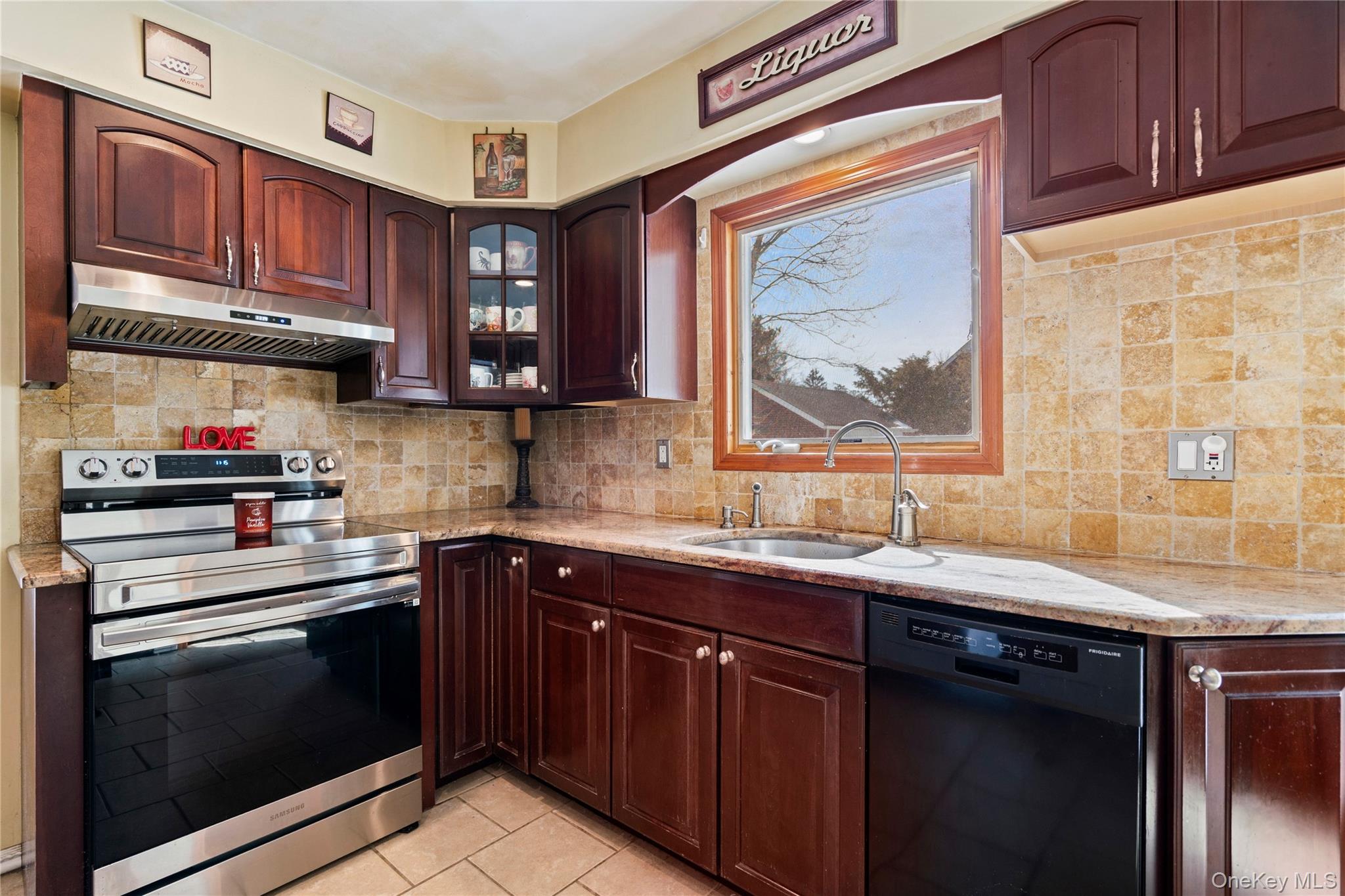 25 State Place Huntington, NY 11743 - Photo 19 of 33 a kitchen with stainless steel appliances granite countertop a sink stove and cabinets