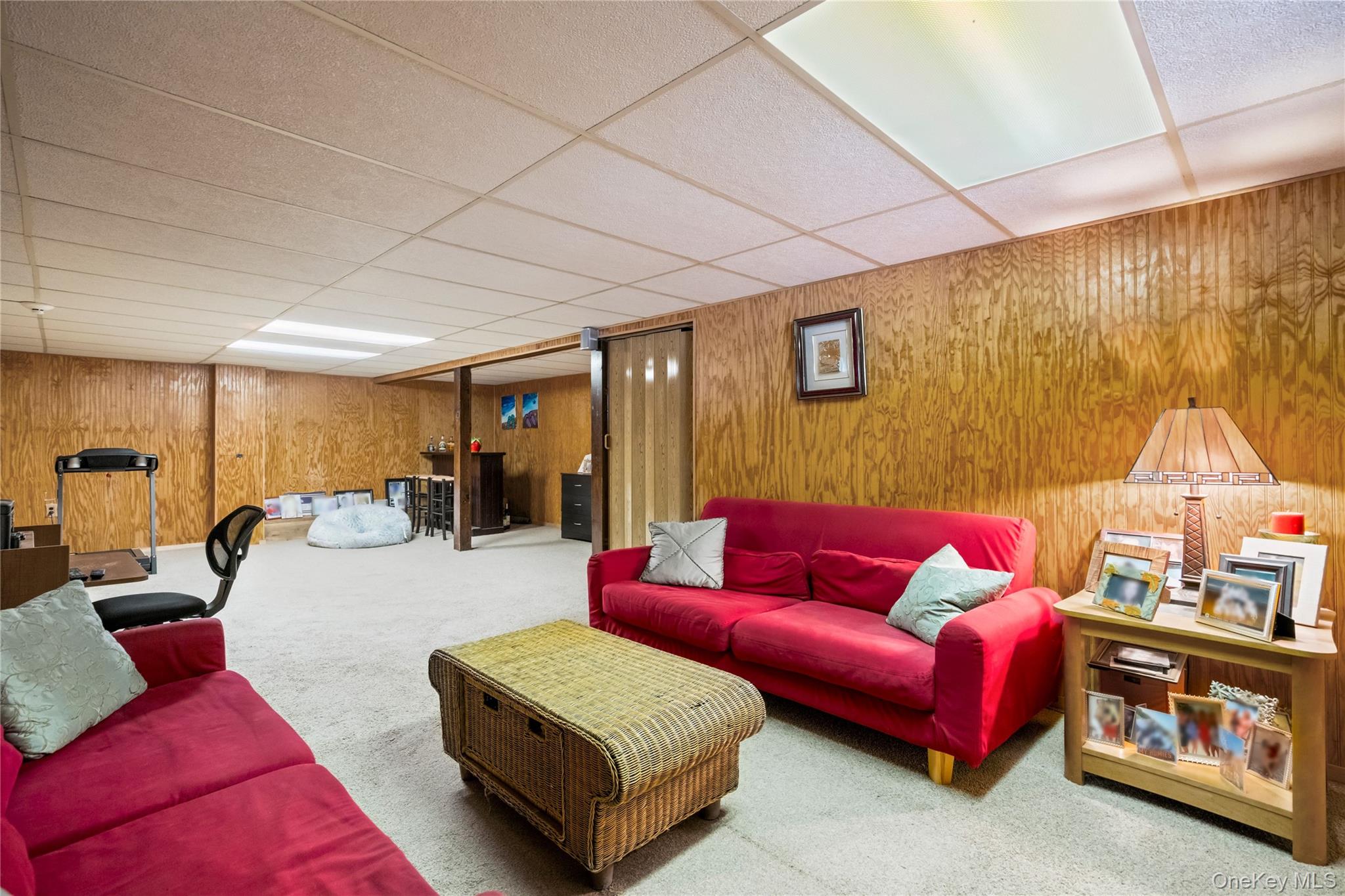 25 State Place Huntington, NY 11743 - Photo 28 of 33 a living room with furniture and a flat screen tv