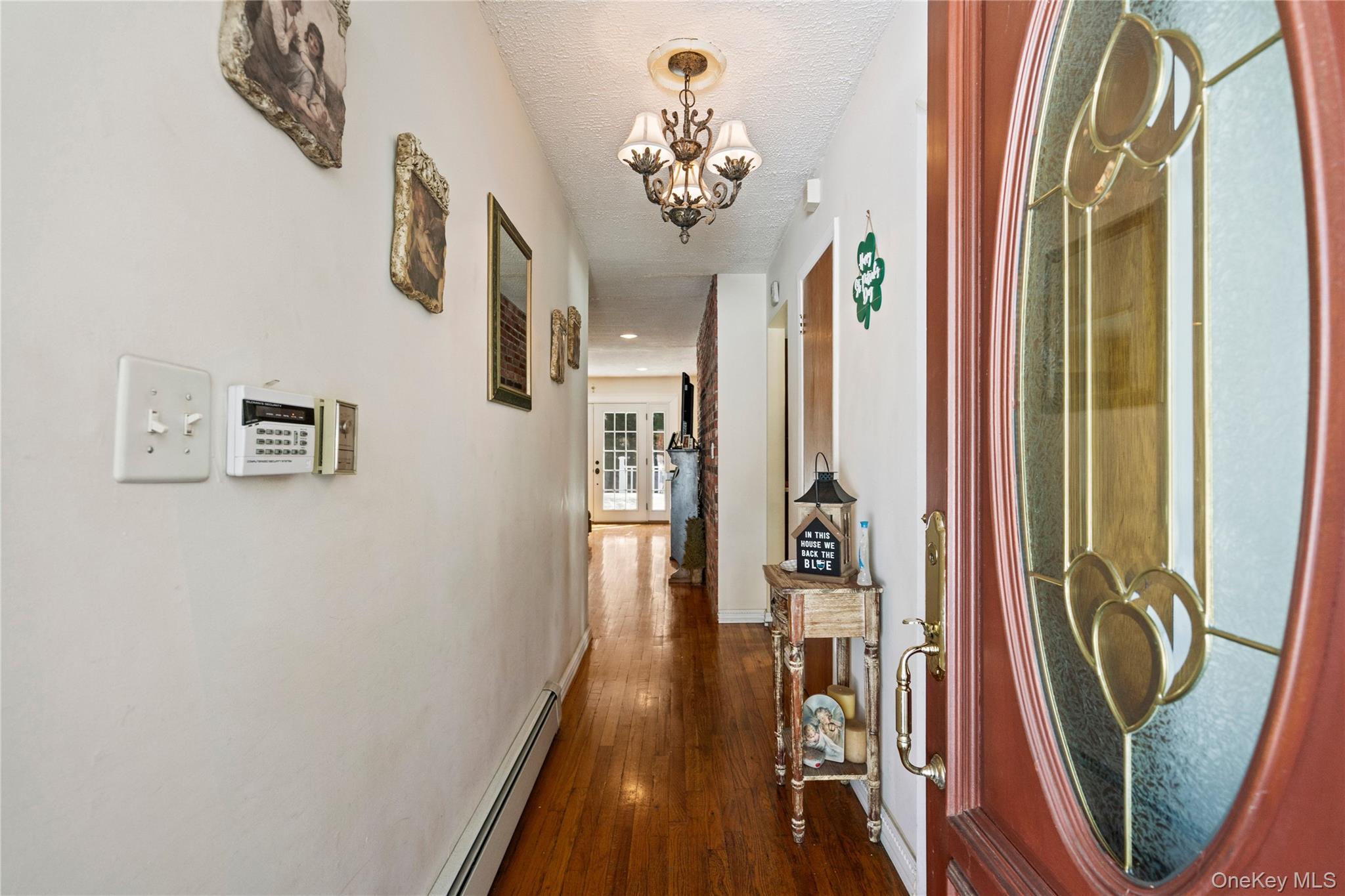 25 State Place Huntington, NY 11743 - Photo 4 of 33 a view of a hallway with wooden floor and stairs