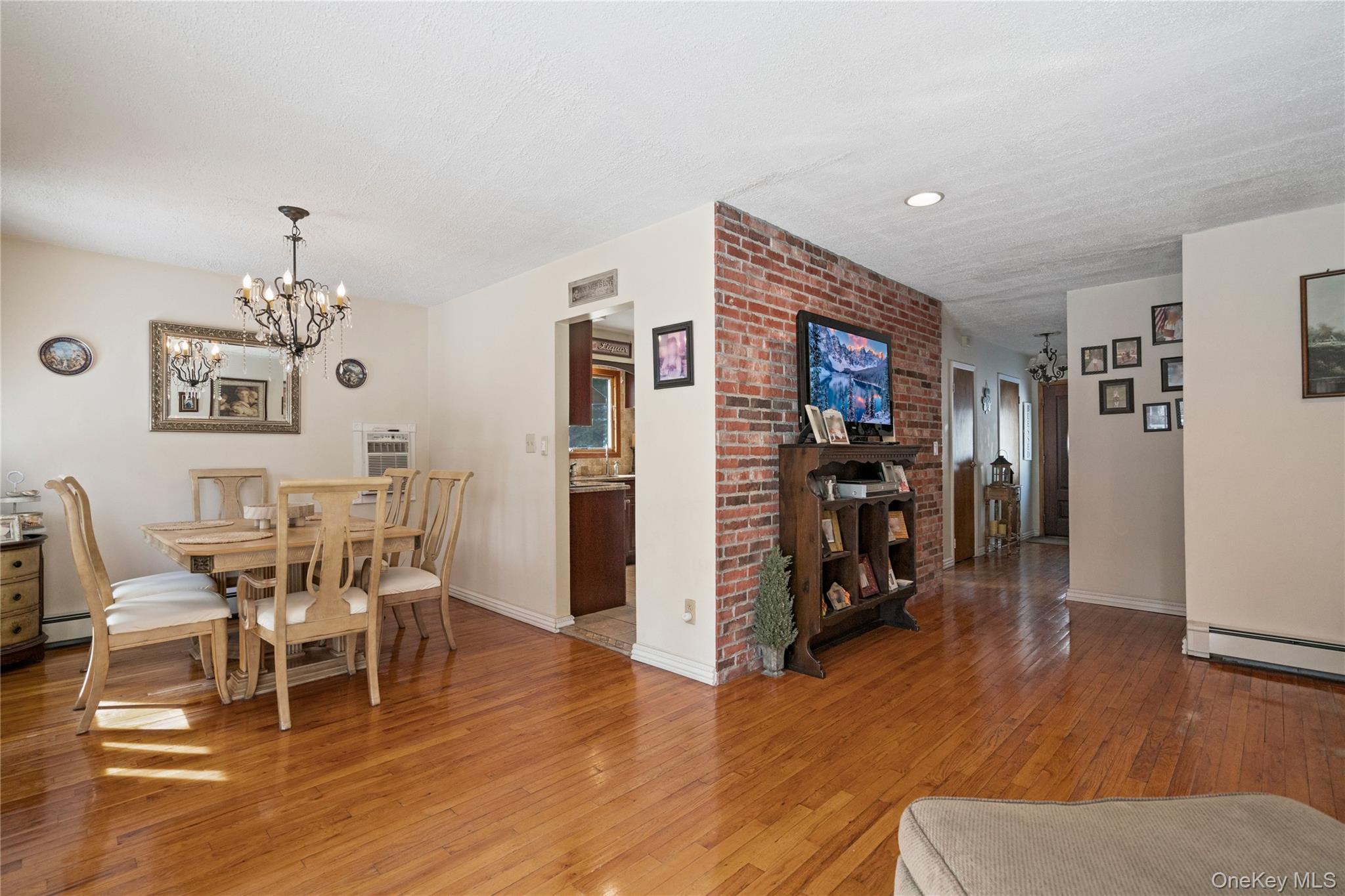 25 State Place Huntington, NY 11743 - Photo 7 of 33 a view of a dining room with furniture wooden floor and a chandelier