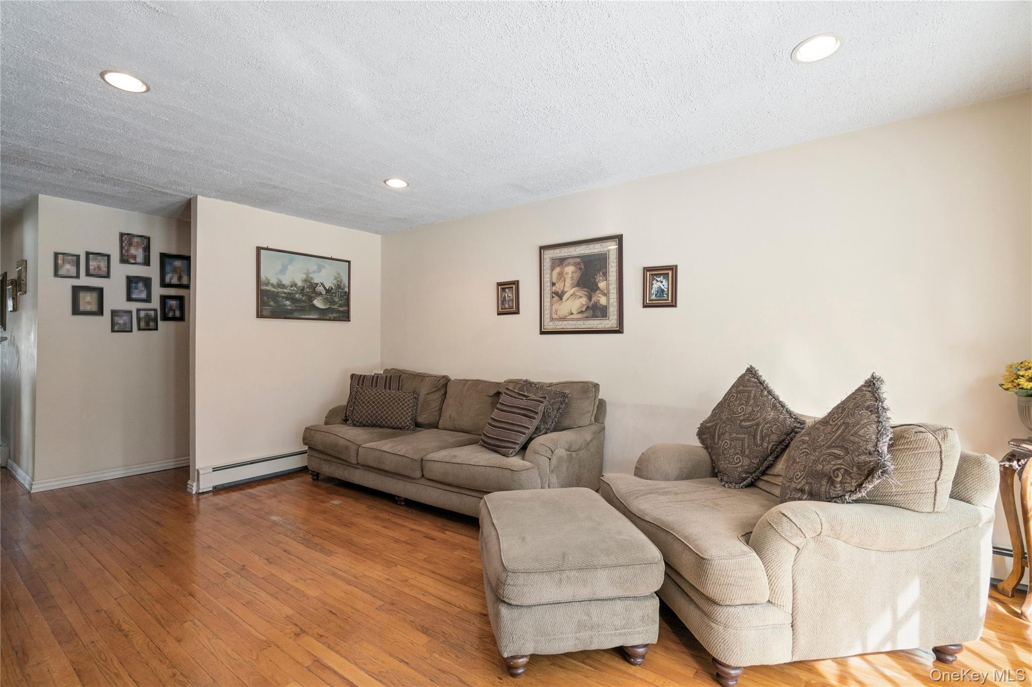25 State Place Huntington, NY 11743 - Photo 8 of 33 a living room with furniture and a wooden floor