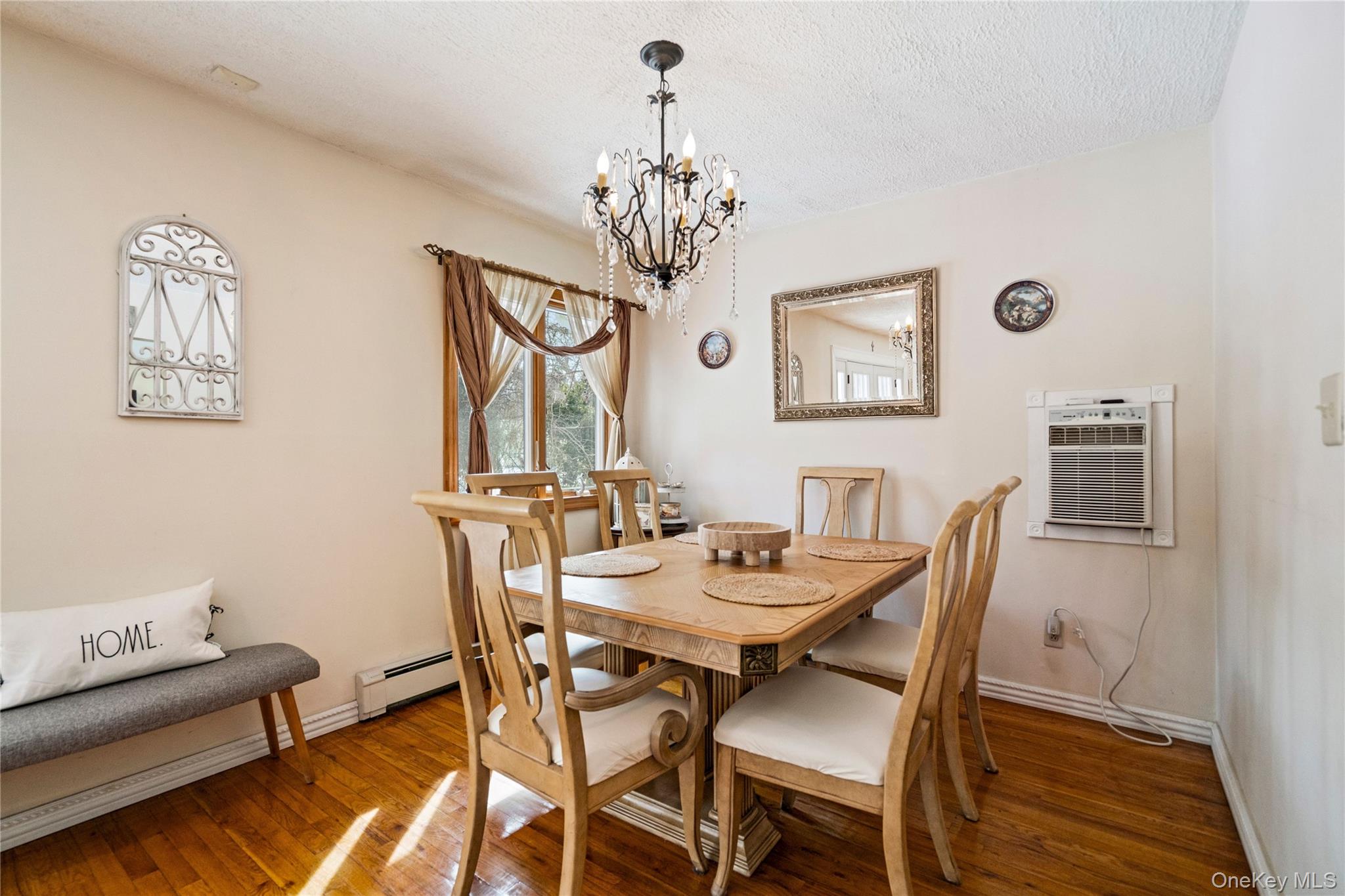 25 State Place Huntington, NY 11743 - Photo 10 of 33 a view of a dining room with furniture and chandelier