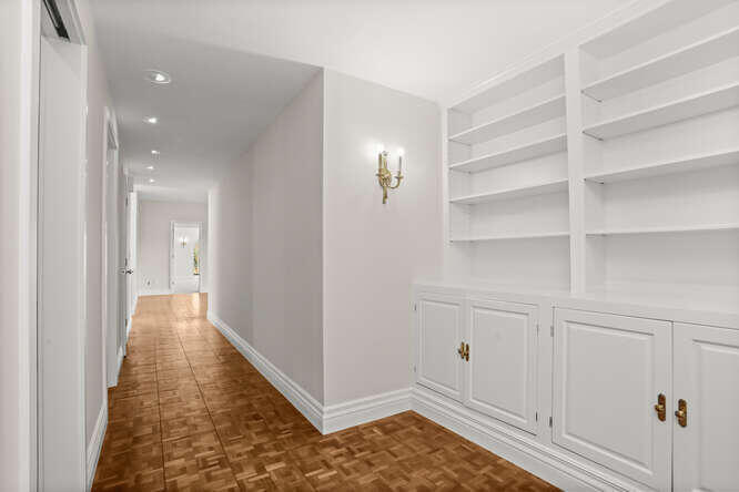 87 Lambert Road New Canaan, CT 06840 - Photo 12 of 39 a view of a hallway with wooden floor