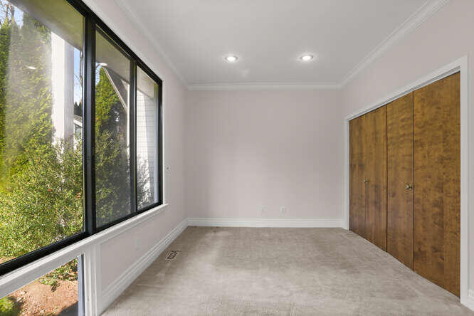 87 Lambert Road New Canaan, CT 06840 - Photo 19 of 39 a view of a hallway with windows