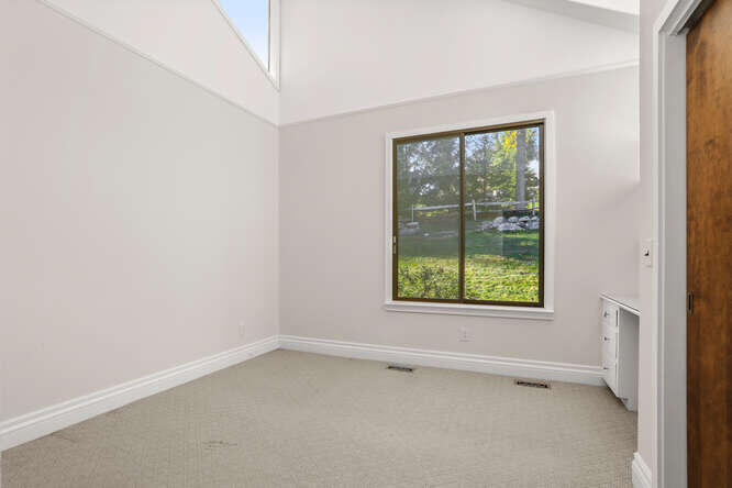 87 Lambert Road New Canaan, CT 06840 - Photo 20 of 39 an empty room with a window