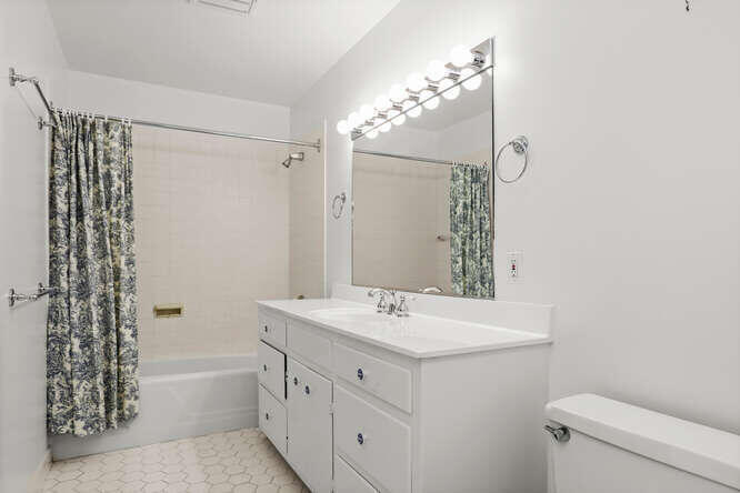 87 Lambert Road New Canaan, CT 06840 - Photo 27 of 39 a bathroom with a sink a toilet and shower