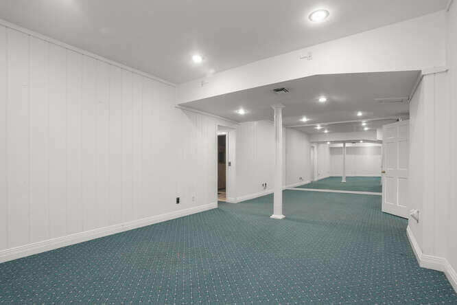 87 Lambert Road New Canaan, CT 06840 - Photo 30 of 39 an empty room with wooden floor and windows