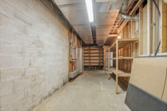 87 Lambert Road New Canaan, CT 06840 - Photo 31 of 39 a view of walk in closet with empty racks