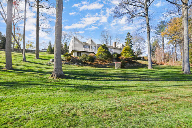 87 Lambert Road New Canaan, CT 06840 - Photo 36 of 39 a view of a park with large trees