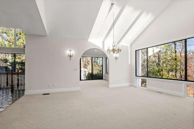 87 Lambert Road New Canaan, CT 06840 - Photo 9 of 39 a view of an empty room with a window