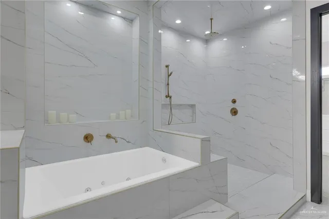 a bathroom with a bathtub and a shower