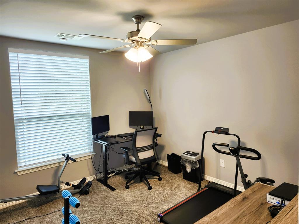 110 Joyce Street Whitney, TX 76692 - Photo 5 of 13 a view of a workspace with furniture and a window