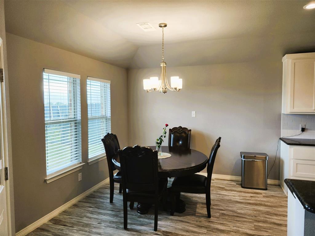 110 Joyce Street Whitney, TX 76692 - Photo 6 of 13 a view of a dining room with furniture window and wooden floor