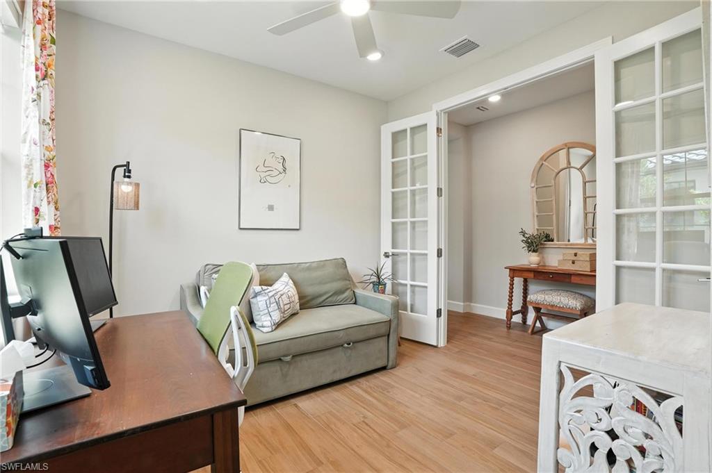 11945 Sacra Place Fort Myers, FL 33913 - Photo 18 of 50 Home office featuring a ceiling fan, light wood-style floors, french doors, and recessed lighting