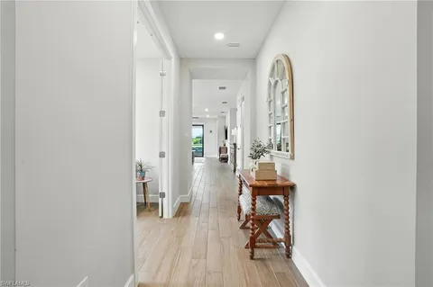 a view of a room with wooden floor and cabinet