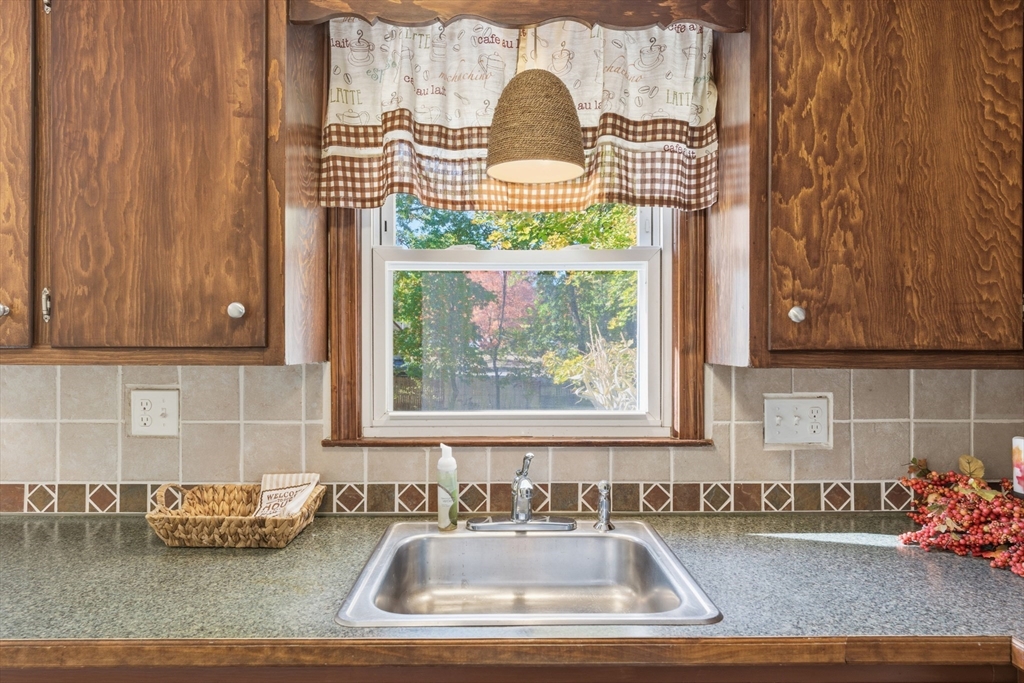 22 Phelps Street Easthampton, MA 01027 - Photo 11 of 42 a kitchen with a sink and a window