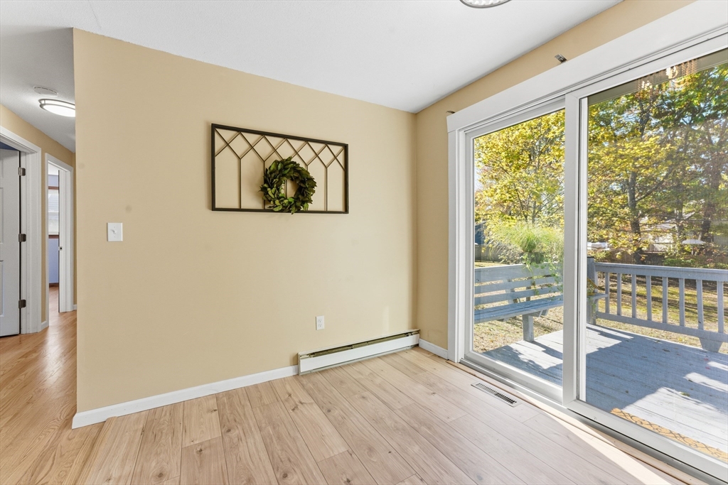 22 Phelps Street Easthampton, MA 01027 - Photo 15 of 42 a view of an empty room with wooden floor and a window