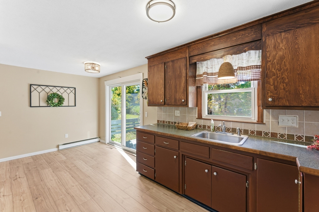 22 Phelps Street Easthampton, MA 01027 - Photo 19 of 42 a kitchen with a sink window and cabinets