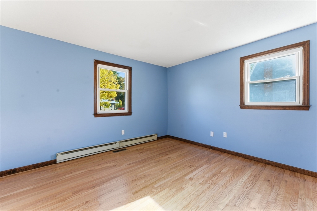 22 Phelps Street Easthampton, MA 01027 - Photo 20 of 42 a view of an empty room with wooden floor and a window