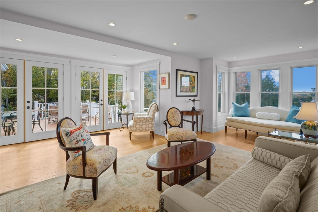 1881 Main Road Westport, MA 02791 - Photo 21 of 42 a living room with furniture and floor to ceiling windows