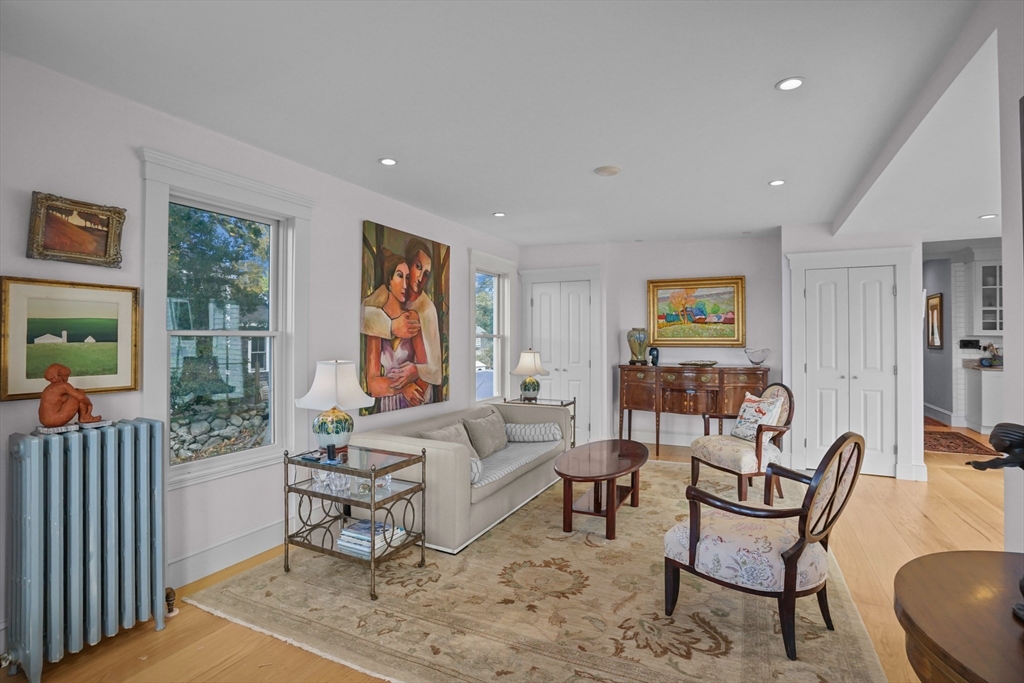 1881 Main Road Westport, MA 02791 - Photo 22 of 42 a living room with furniture and a painting on the wall