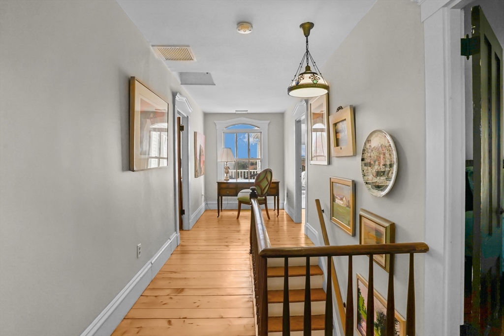 1881 Main Road Westport, MA 02791 - Photo 29 of 42 a view of a hallway with wooden floor