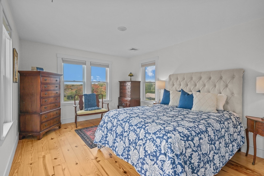 1881 Main Road Westport, MA 02791 - Photo 31 of 42 a bedroom with a large bed and furniture