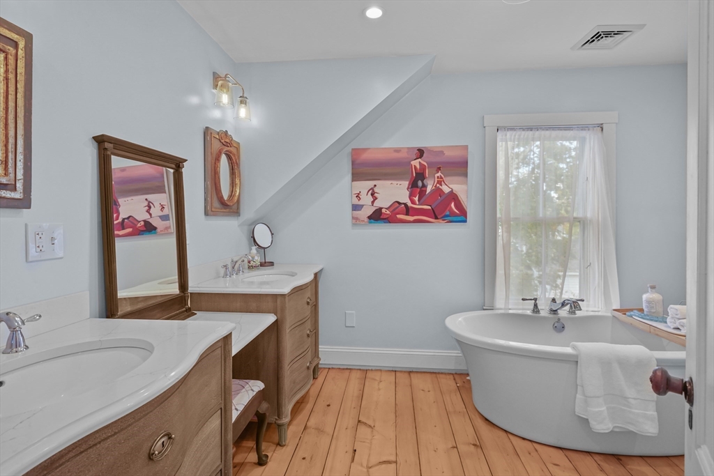 1881 Main Road Westport, MA 02791 - Photo 35 of 42 a bath room with a sink and a mirror