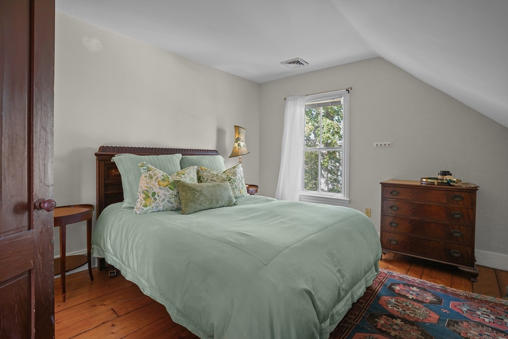 1881 Main Road Westport, MA 02791 - Photo 40 of 42 a bedroom with a bed and a dresser