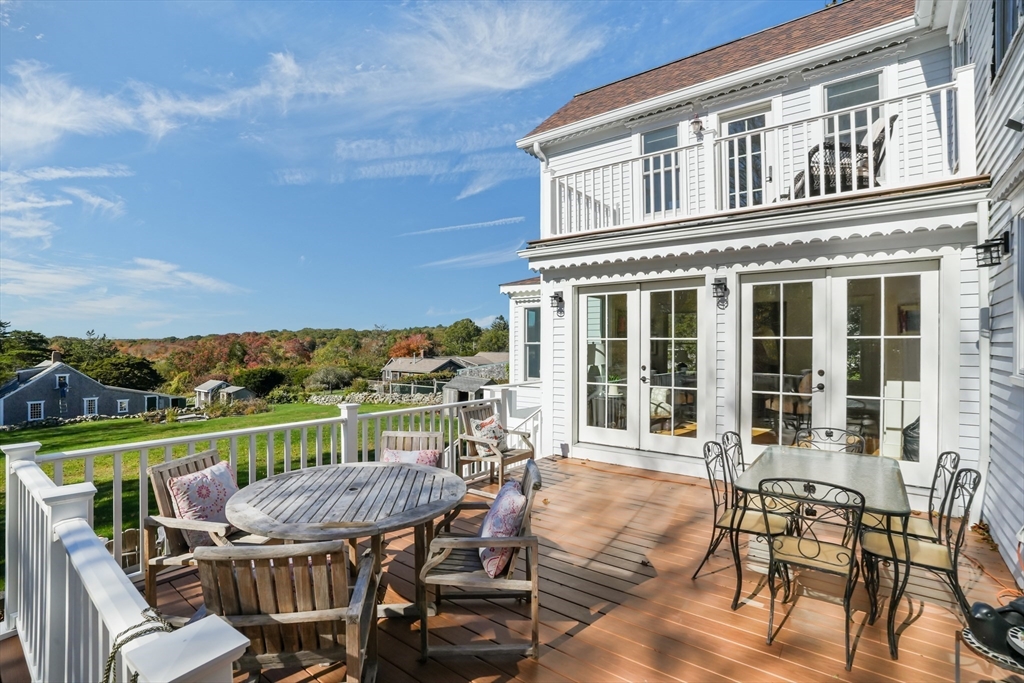 1881 Main Road Westport, MA 02791 - Photo 41 of 42 a view of a chair and table on the roof deck