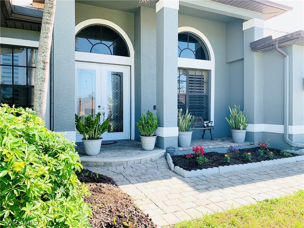 17409 Fuchsia Road Fort Myers, FL 33967 - Photo 3 of 35 a view of a house with potted plants