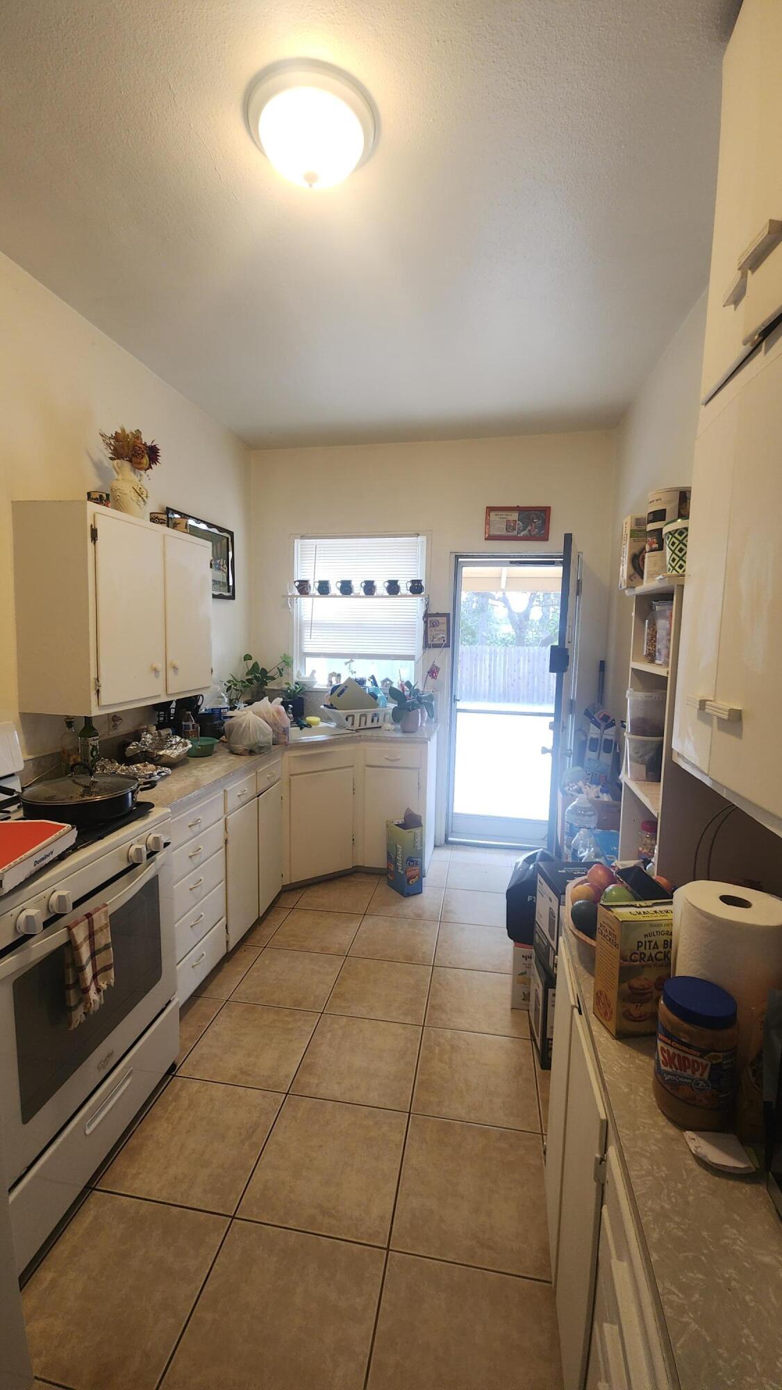 806 East Main Street Santa Maria, CA 93454 - Photo 17 of 29 a kitchen with a stove a sink and a refrigerator