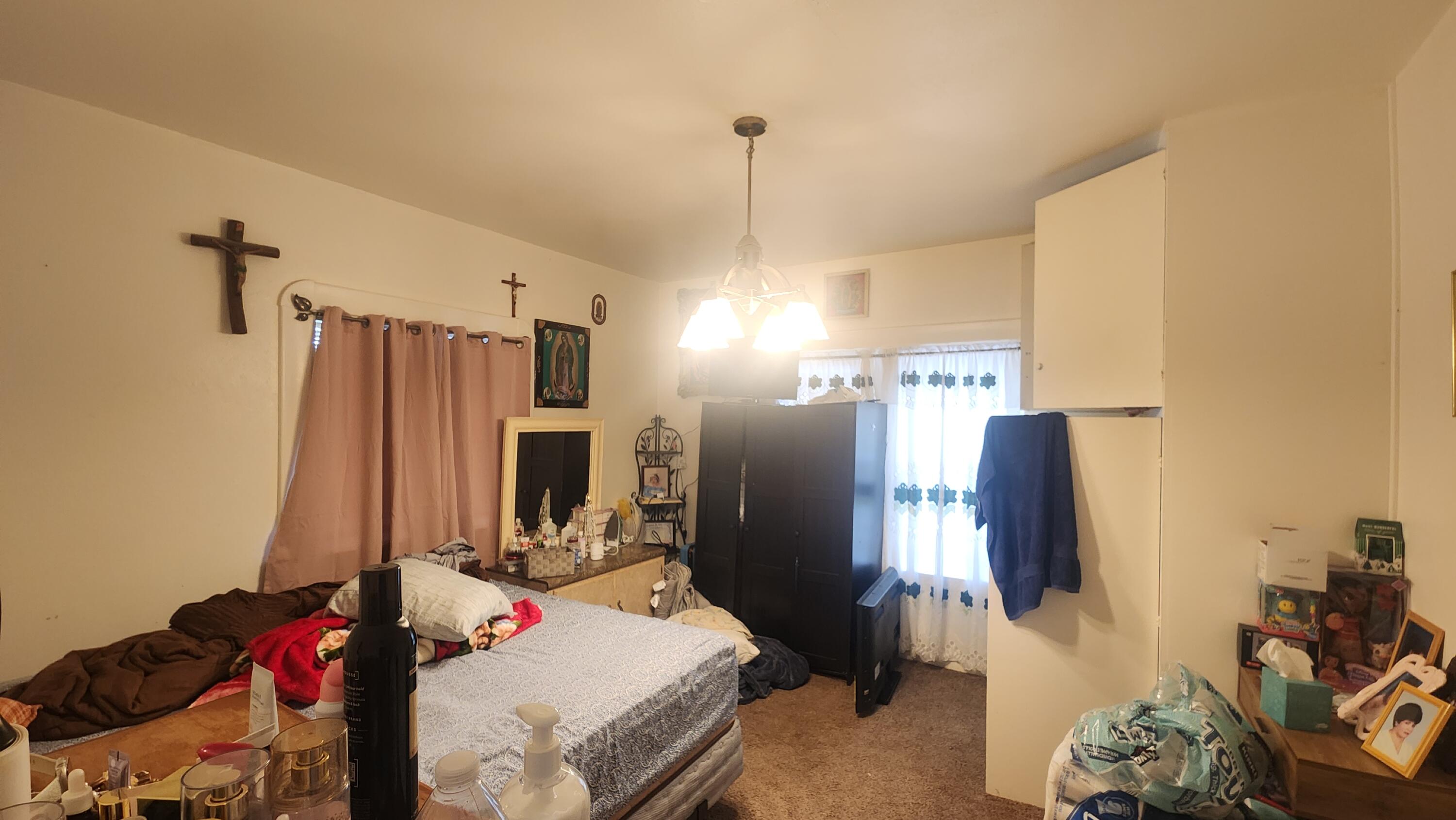806 East Main Street Santa Maria, CA 93454 - Photo 21 of 29 a living room with furniture a flat screen tv and a refrigerator