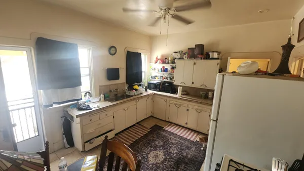 a kitchen with a sink appliances and cabinets