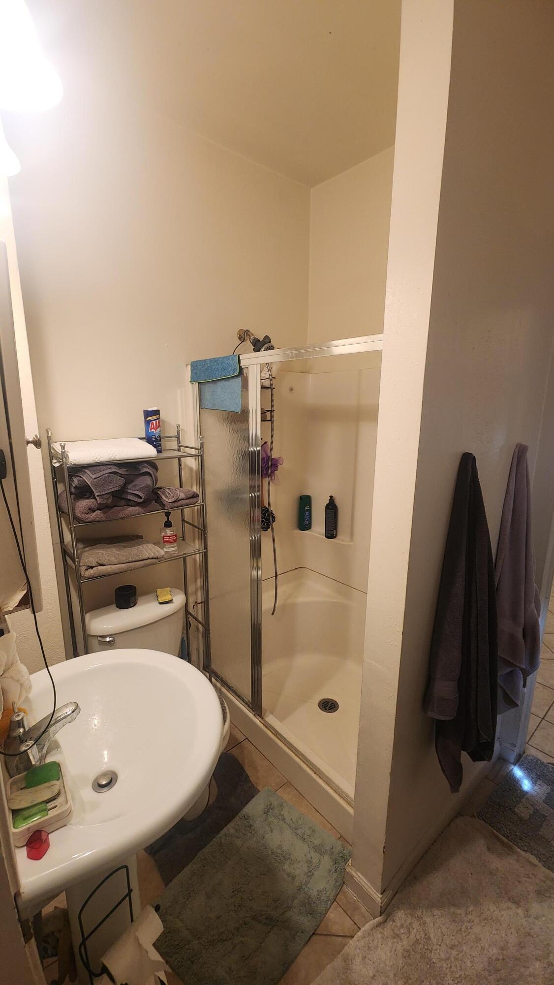 806 East Main Street Santa Maria, CA 93454 - Photo 9 of 29 a bathroom with a sink and a shower