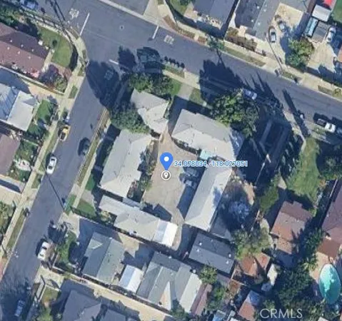 an aerial view of multiple houses with outdoor space